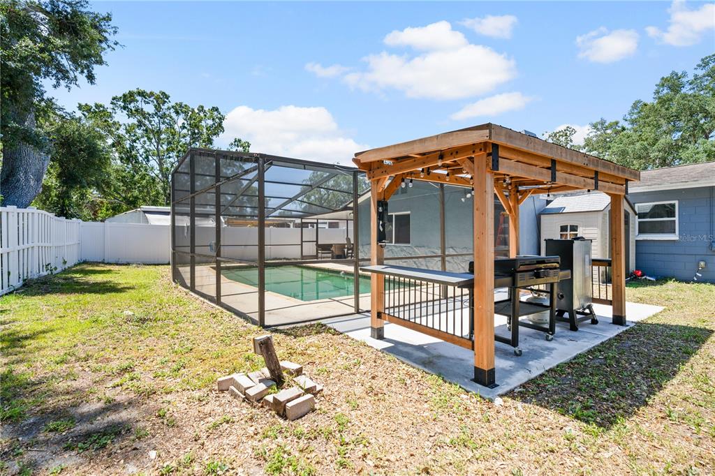 9653 Golden Grove Street Seminole, FL 33772 - Photo 24 of 29 a view of a house with a wooden fence
