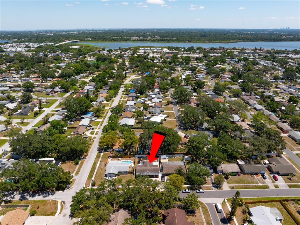 9653 Golden Grove Street Seminole, FL 33772 - Photo 28 of 29 an aerial view of residential houses with outdoor space and trees