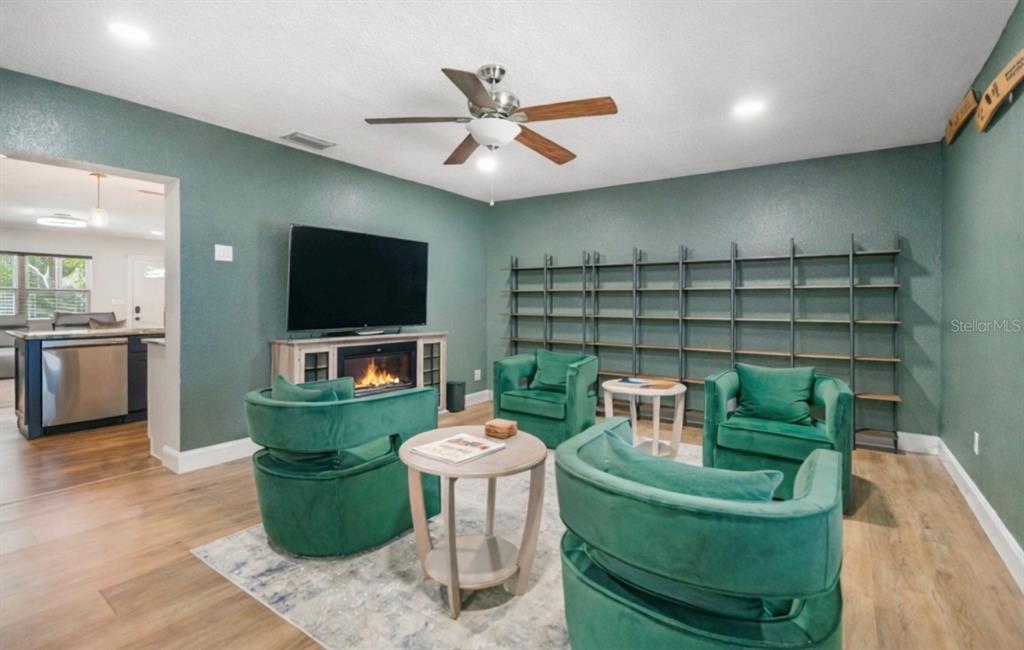 9653 Golden Grove Street Seminole, FL 33772 - Photo 10 of 29 a living room with furniture and a flat screen tv