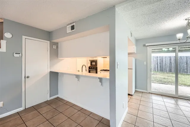 a view of kitchen with furniture and window