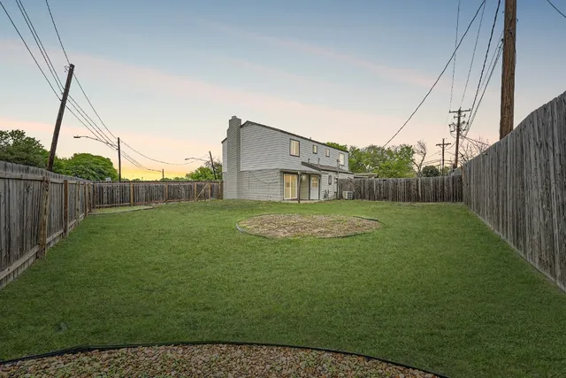a backyard of a house with lots of green space