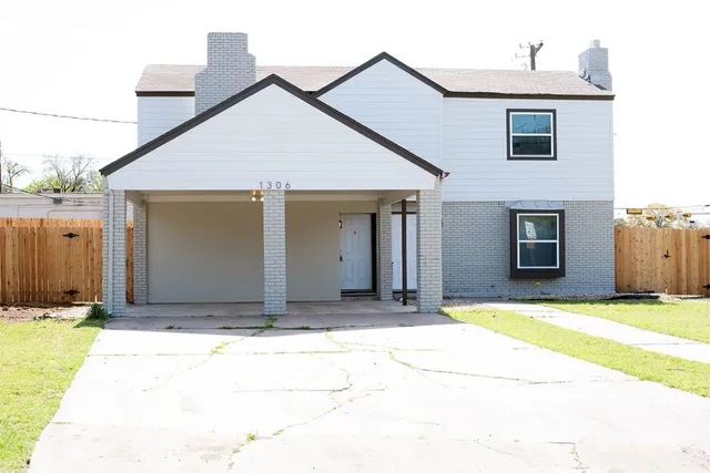 a house with yard in front of it