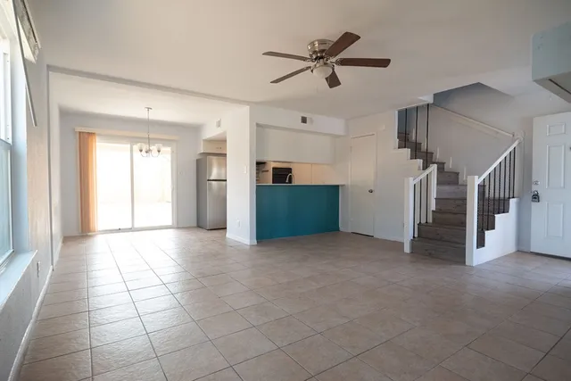 a view of a livingroom with a staircase