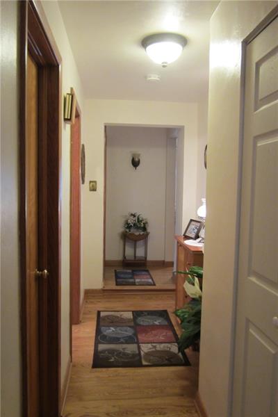 467 Old Hickory Ridge Road Washington, PA 15301 - Photo 12 of 25 Hallway between bedrooms. Hardwood flooring.