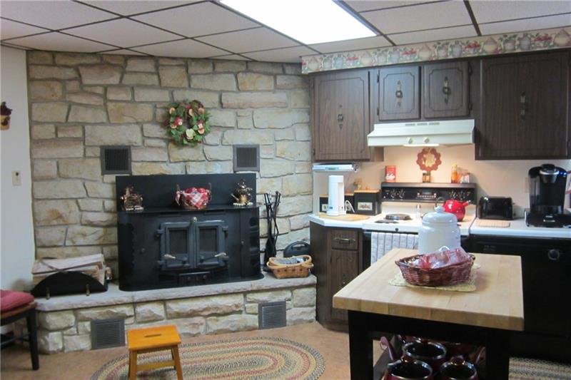 467 Old Hickory Ridge Road Washington, PA 15301 - Photo 5 of 25 You don't see this with new construction - log burning fireplace in the kitchen.