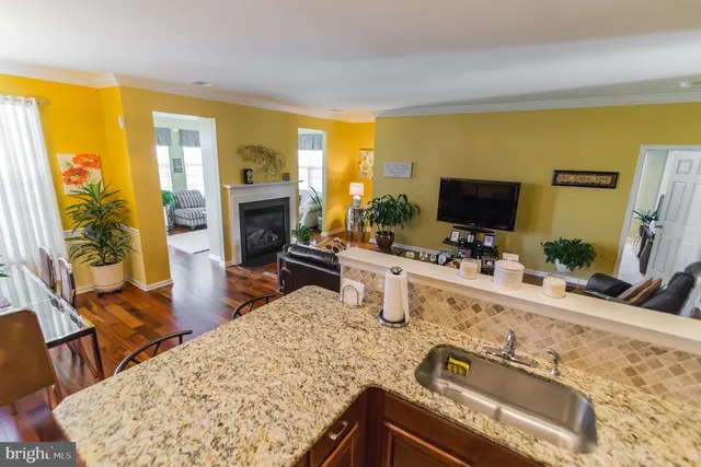a living room with fireplace furniture and a flat screen tv