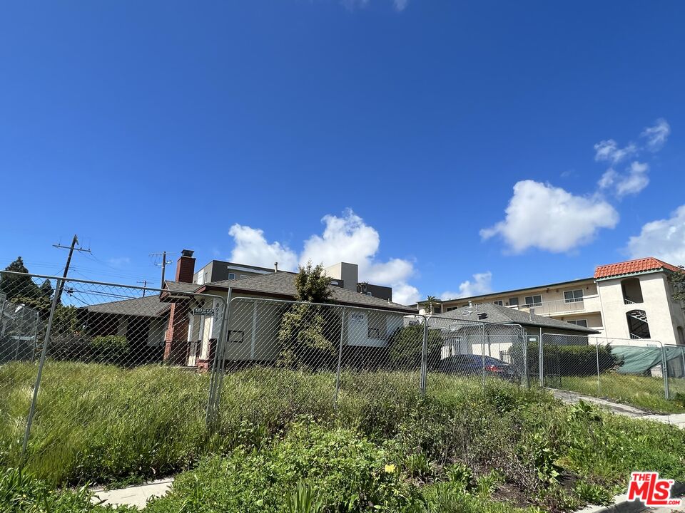 8911 Ramsgate Avenue Los Angeles, CA 90045 - Photo 1 of 3 a front view of a house with a yard