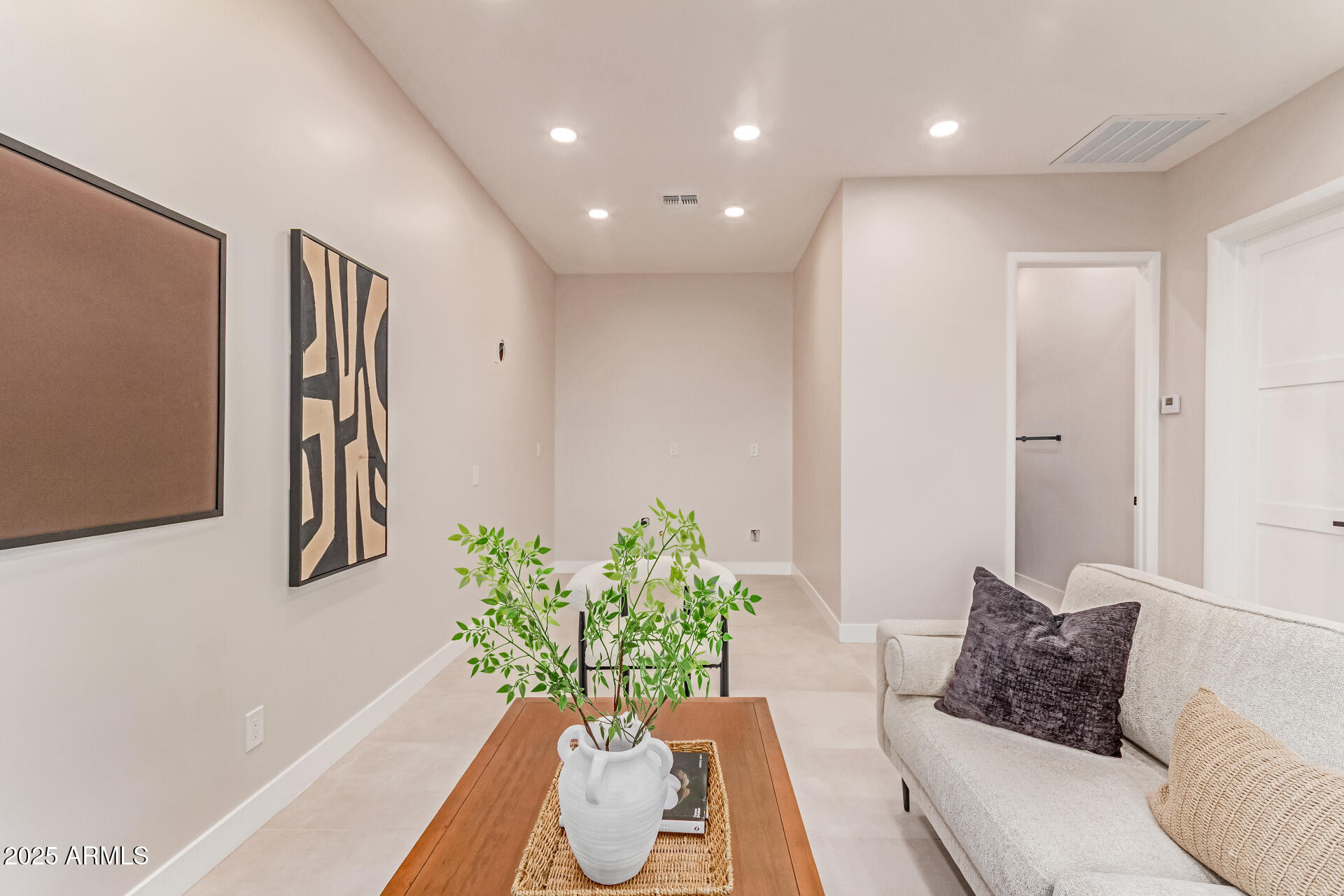 3301 East Rovey Avenue Paradise Valley, AZ 85253 - Photo 75 of 105 a living room with furniture flowerpot and wooden floor