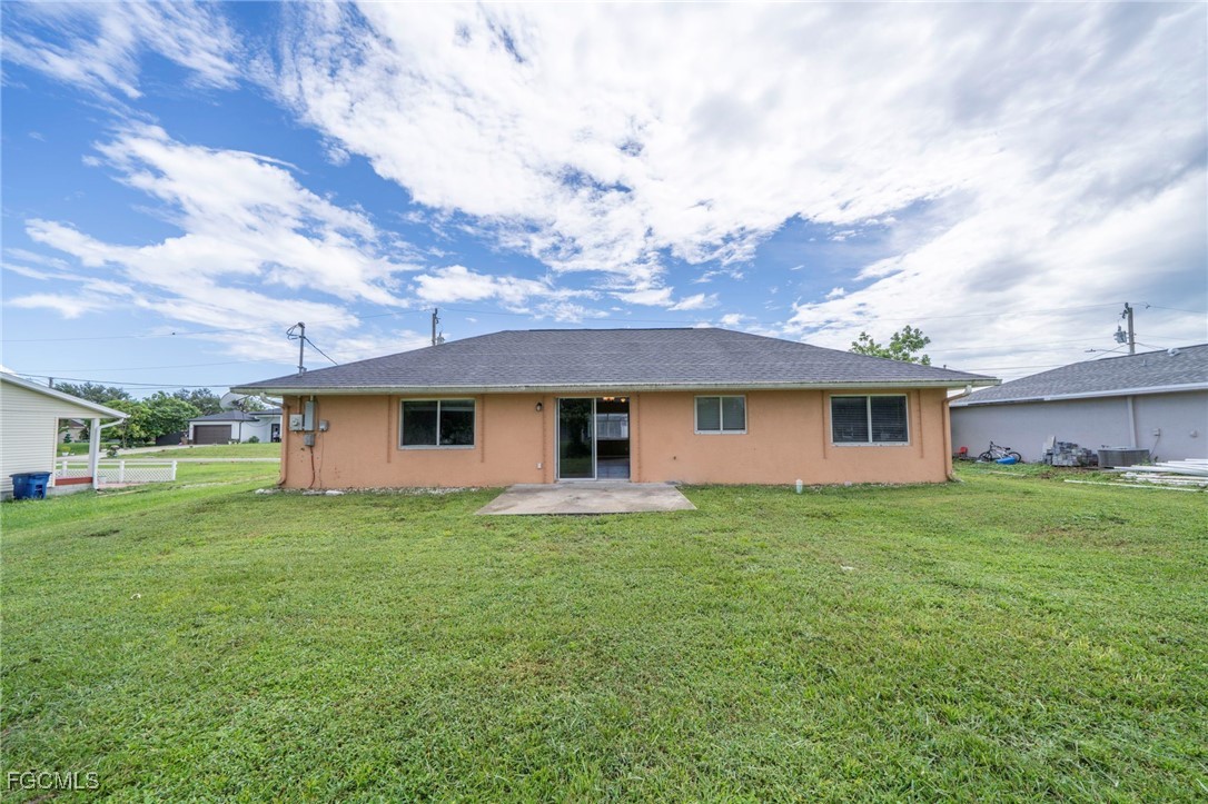 4306 11th Street Southwest Lehigh Acres, FL 33976 - Photo 17 of 17 a house view with a garden space