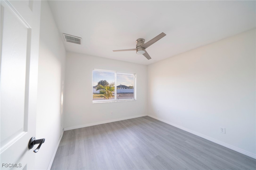 4306 11th Street Southwest Lehigh Acres, FL 33976 - Photo 10 of 17 an empty room with windows
