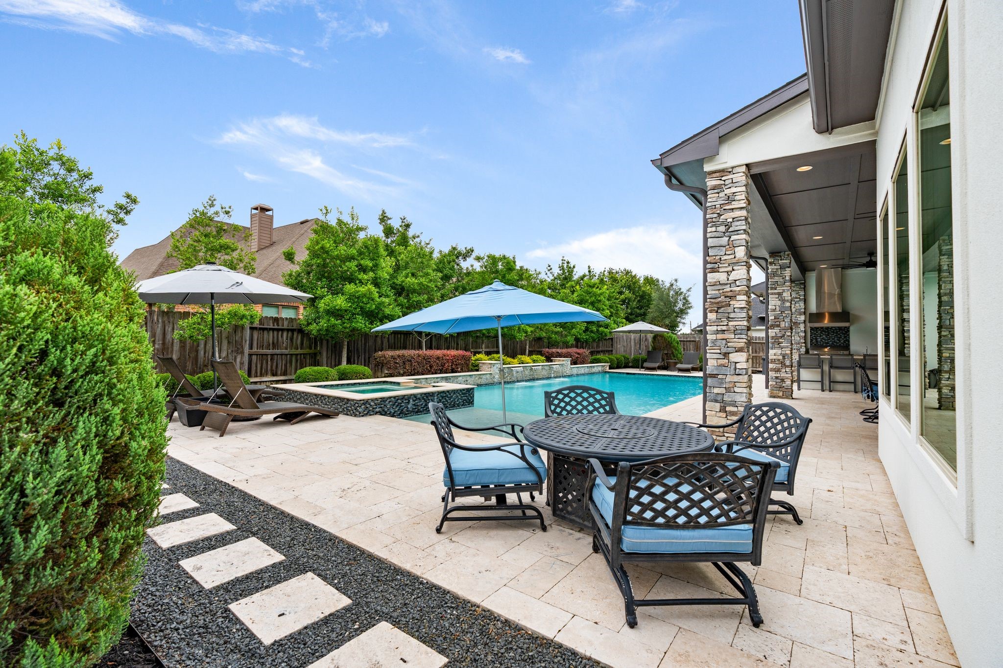 2926 Fairmont Ridge Lane Katy, TX 77494 - Photo 2 of 49 a patio with tables and chairs