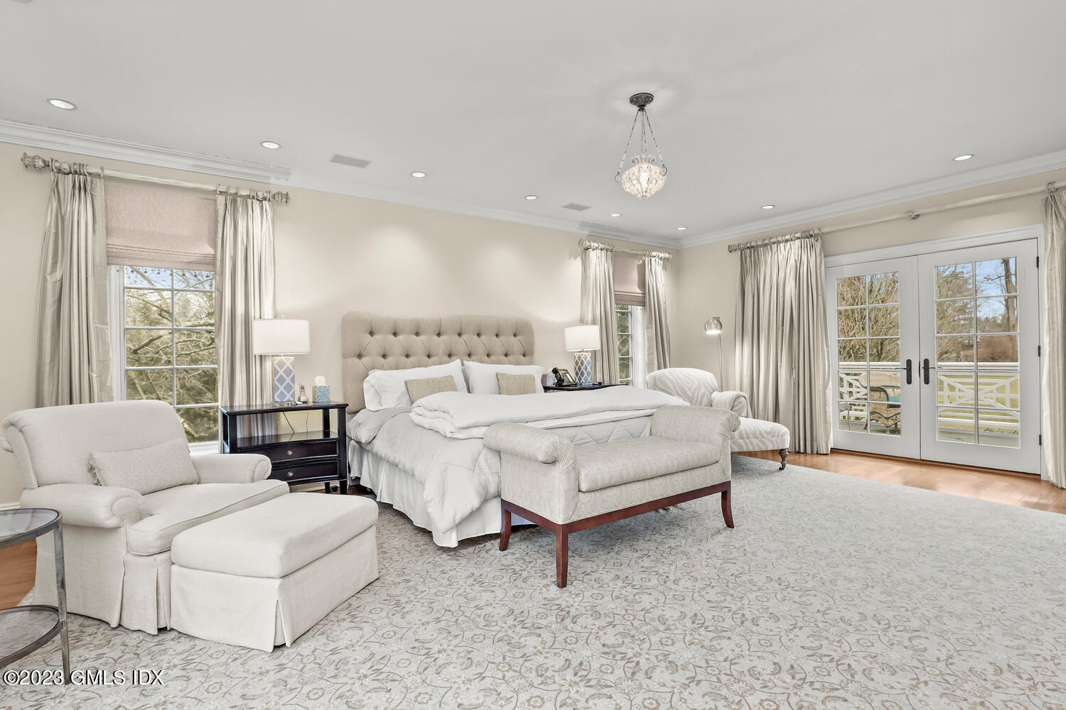 1300 Rock Rimmon Road Stamford, CT 06903 - Photo 15 of 34 a spacious bedroom with a bed a table and large window