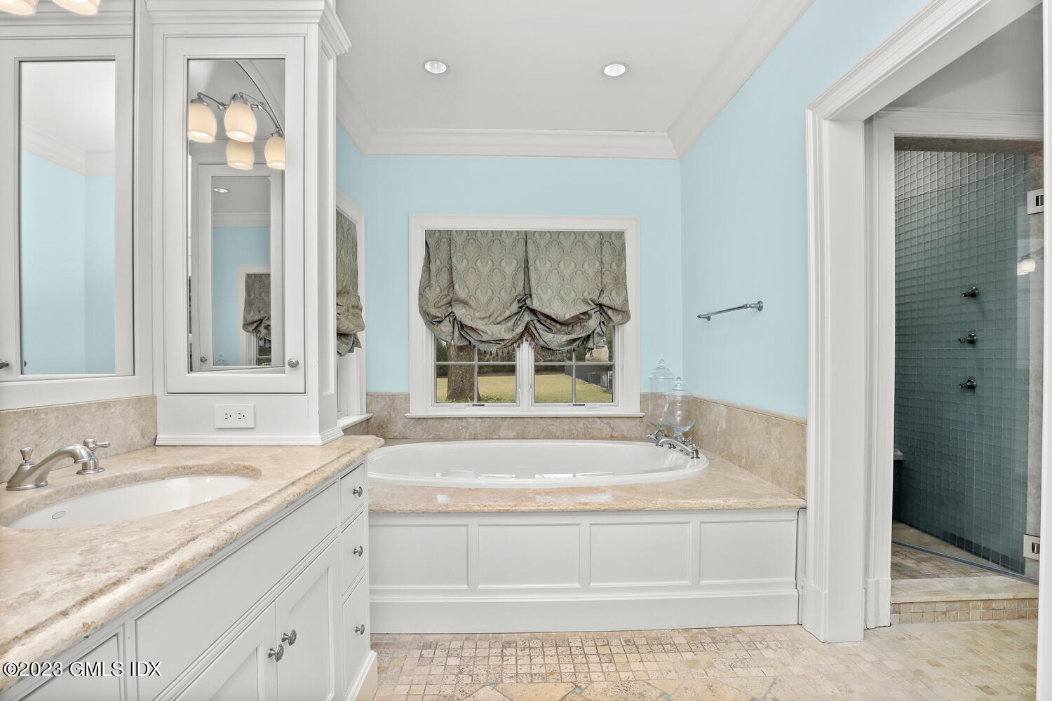 1300 Rock Rimmon Road Stamford, CT 06903 - Photo 17 of 34 a bathroom with a granite countertop tub sink and mirror