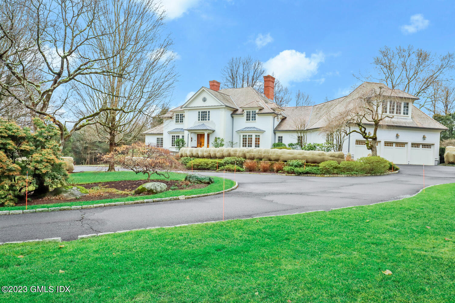 1300 Rock Rimmon Road Stamford, CT 06903 - Photo 2 of 34 a view of white house with a big yard and potted plants