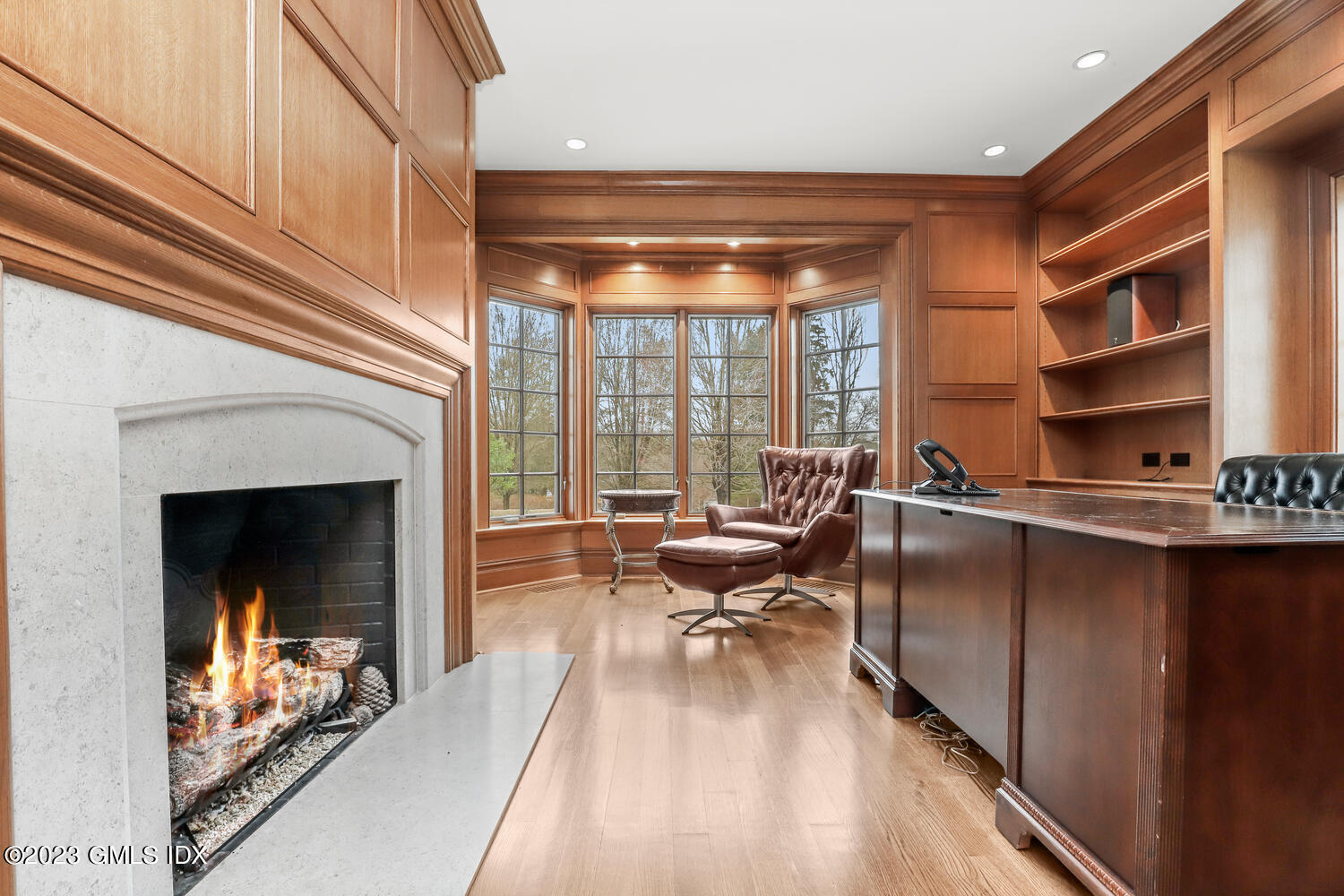 1300 Rock Rimmon Road Stamford, CT 06903 - Photo 4 of 34 a living room with furniture a fireplace and a floor to ceiling window