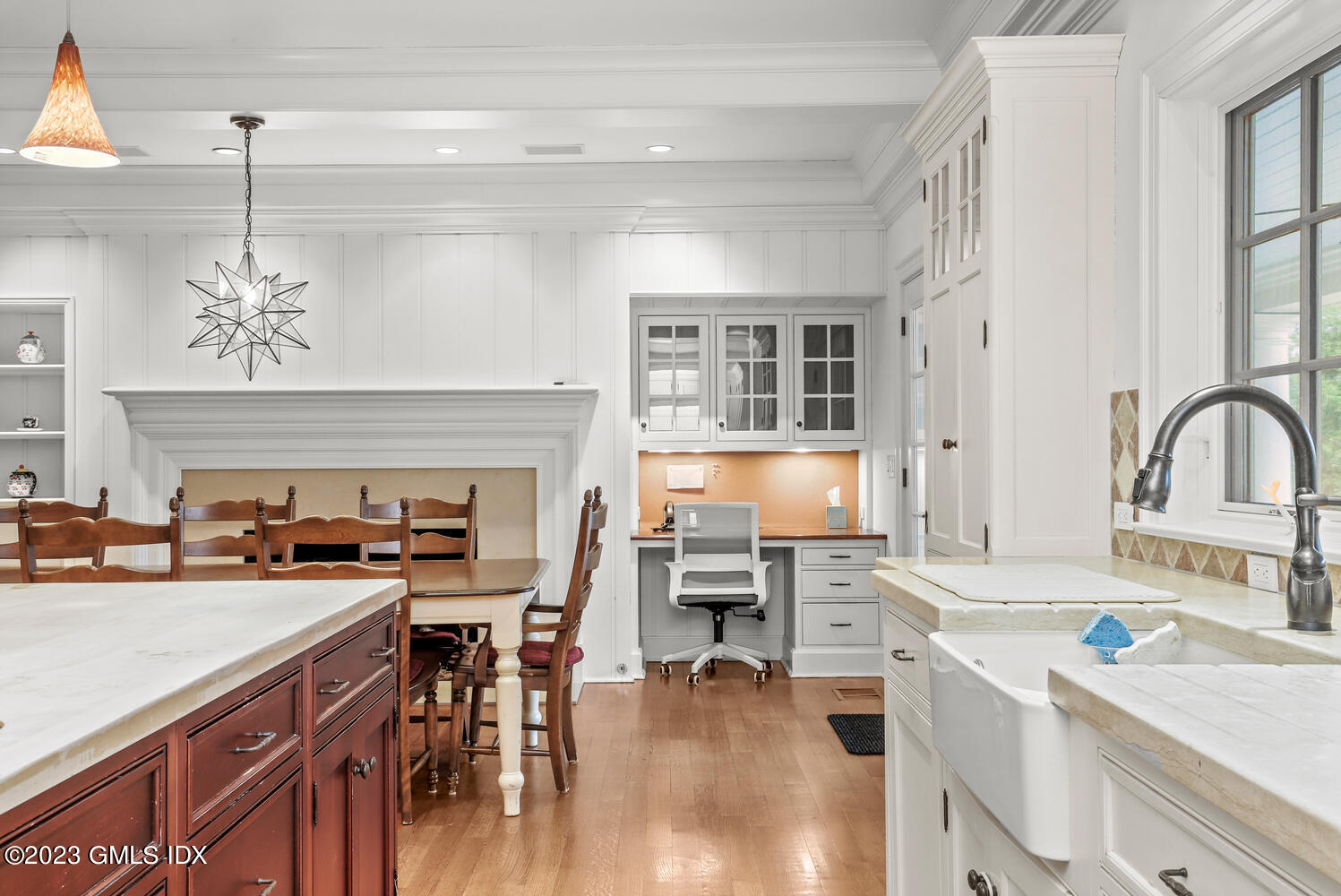 1300 Rock Rimmon Road Stamford, CT 06903 - Photo 8 of 34 a kitchen with a sink stove and cabinets