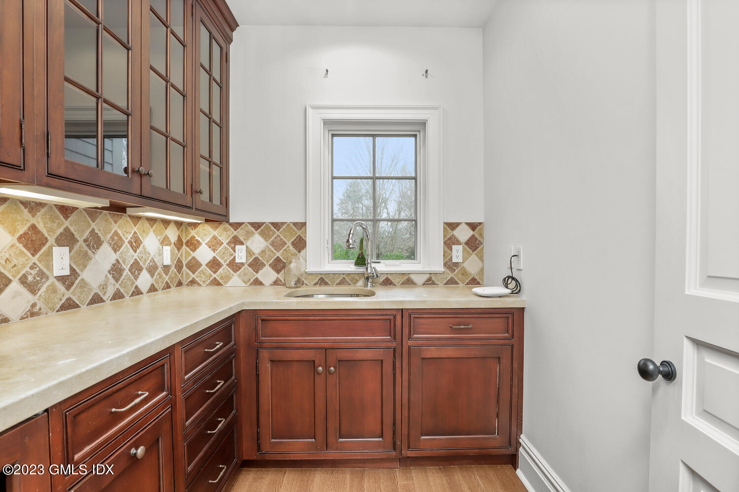 1300 Rock Rimmon Road Stamford, CT 06903 - Photo 9 of 34 a kitchen with a sink and cabinets