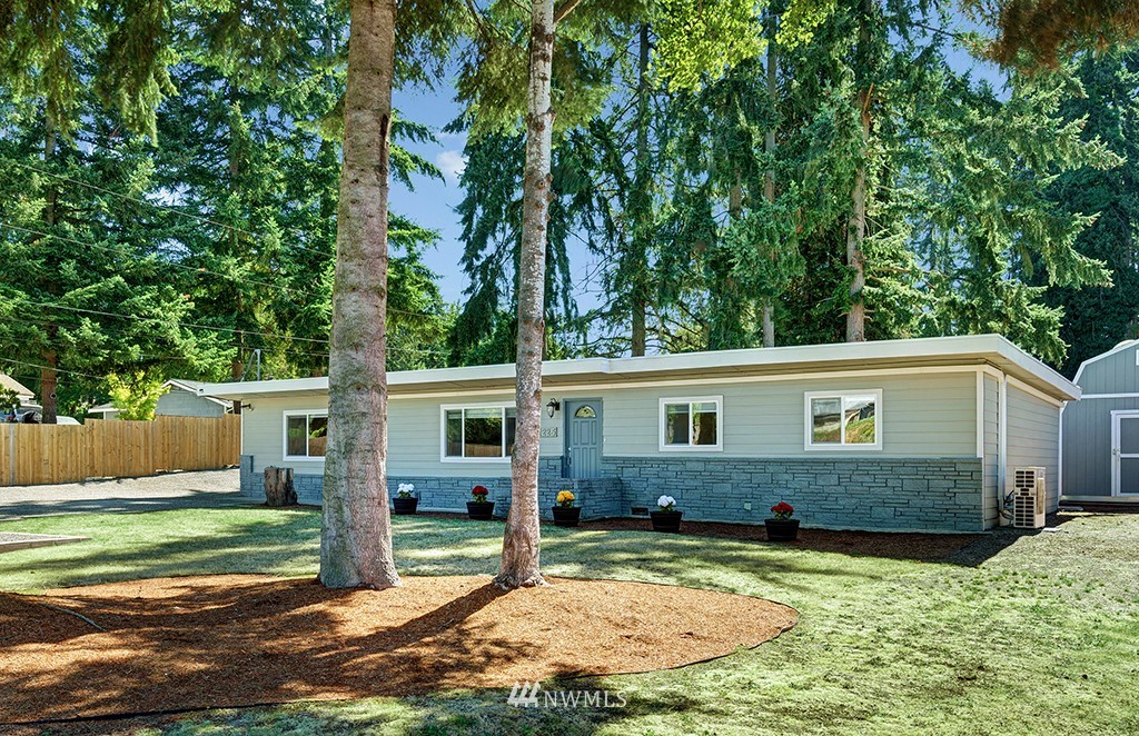 11225 Southeast 22nd Street Renton, WA 98055 - Photo 1 of 28 a view of a house with backyard and sitting area