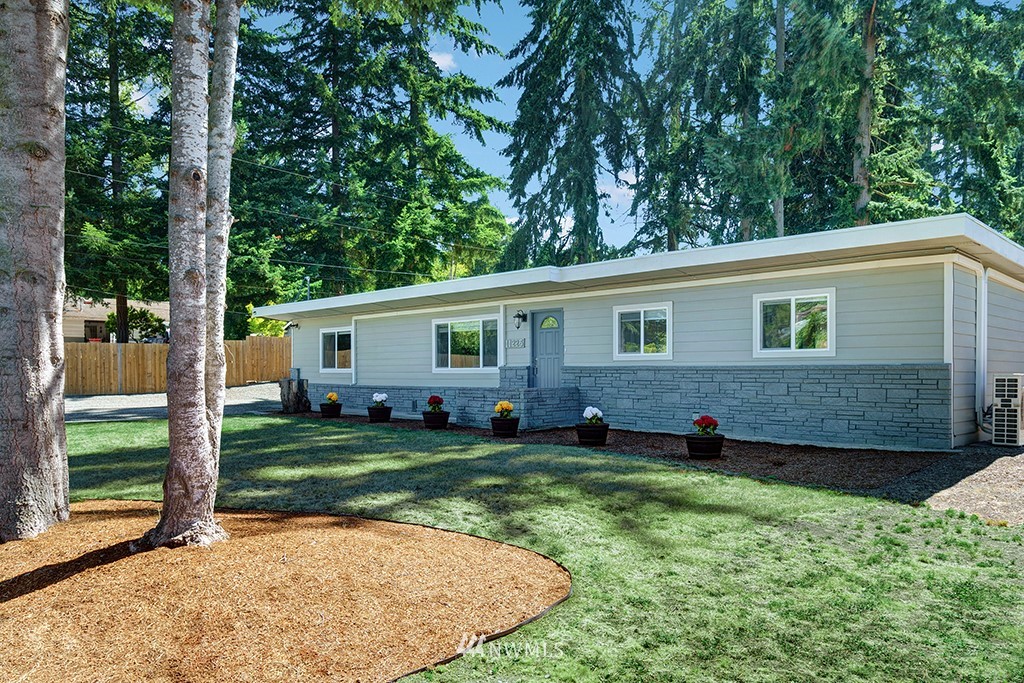 11225 Southeast 22nd Street Renton, WA 98055 - Photo 2 of 28 a view of a backyard with a garden and plants