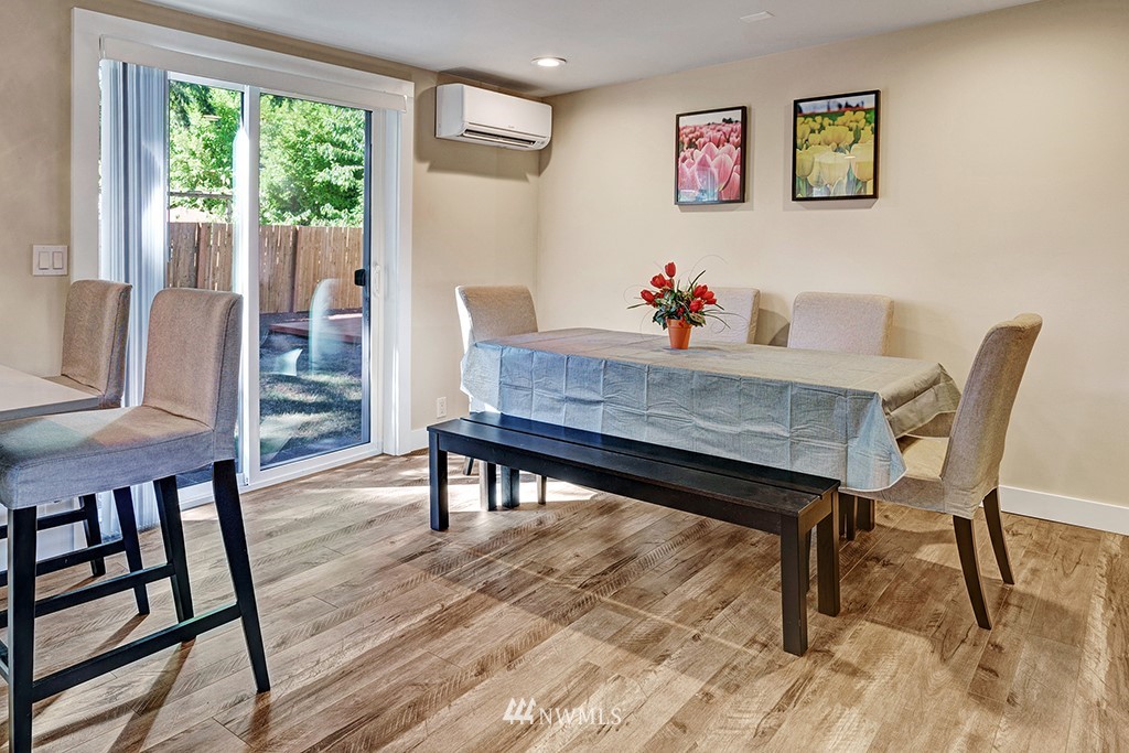 11225 Southeast 22nd Street Renton, WA 98055 - Photo 13 of 28 a dining room with furniture and wooden floor