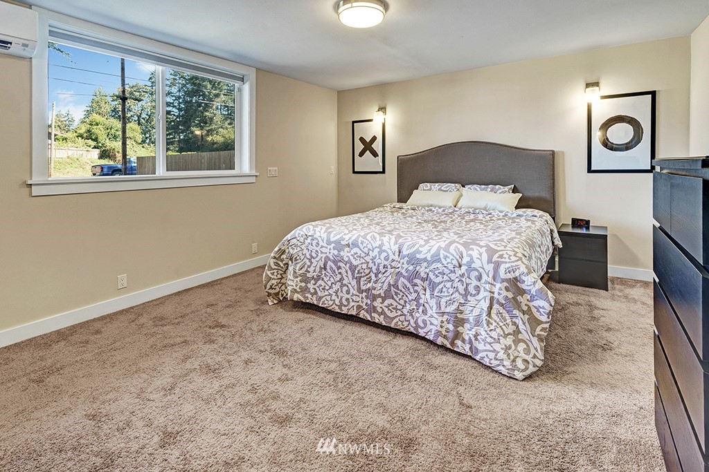 11225 Southeast 22nd Street Renton, WA 98055 - Photo 14 of 28 a bedroom with a bed and a window