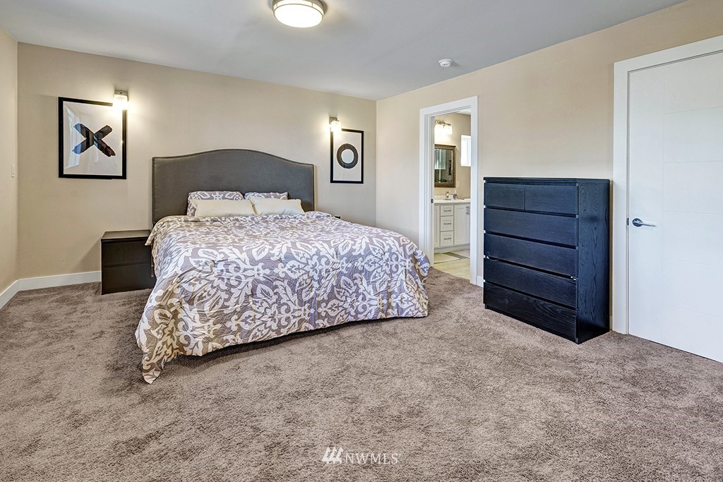 11225 Southeast 22nd Street Renton, WA 98055 - Photo 15 of 28 a bedroom with a bed and a dresser