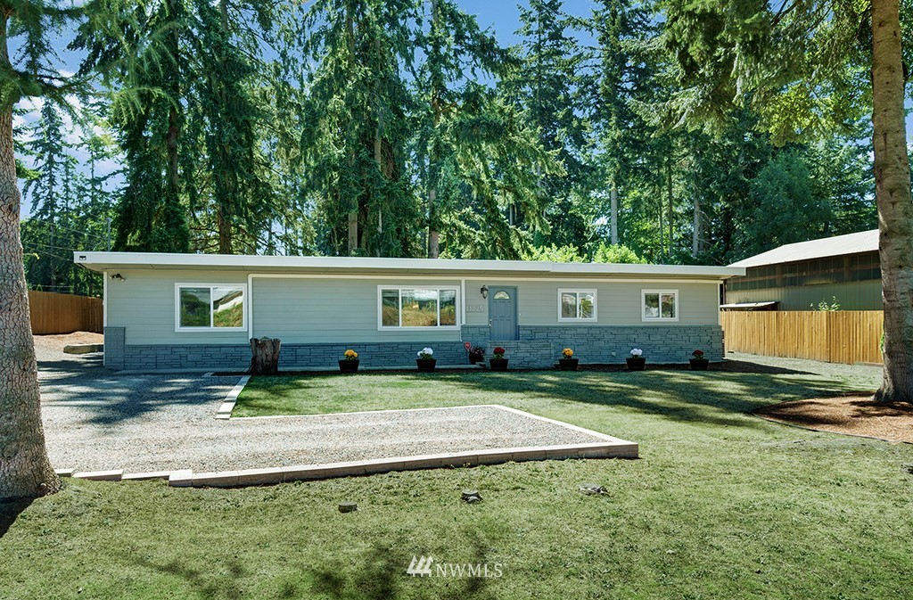 11225 Southeast 22nd Street Renton, WA 98055 - Photo 3 of 28 a front view of house with yard and green space