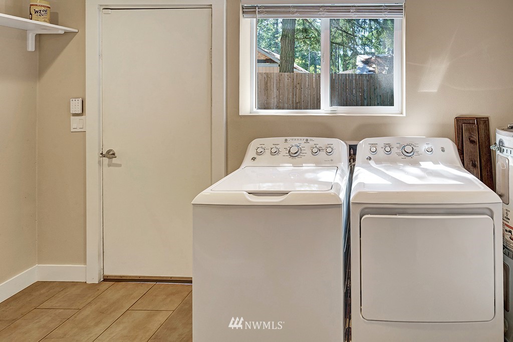 11225 Southeast 22nd Street Renton, WA 98055 - Photo 23 of 28 a utility room with dryer and washer