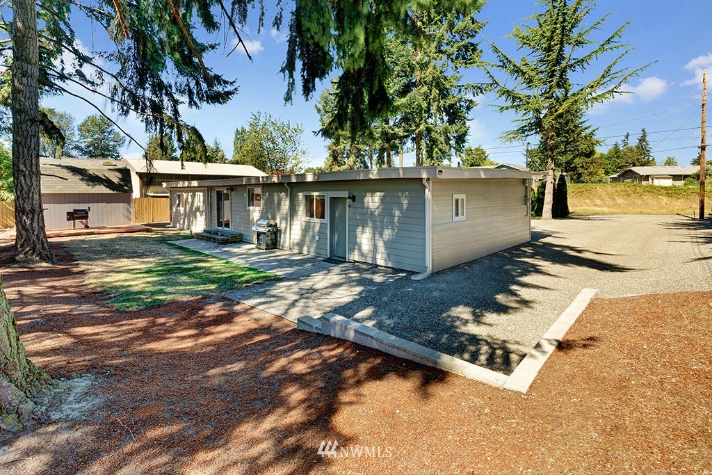 11225 Southeast 22nd Street Renton, WA 98055 - Photo 27 of 28 front view of a house with a yard