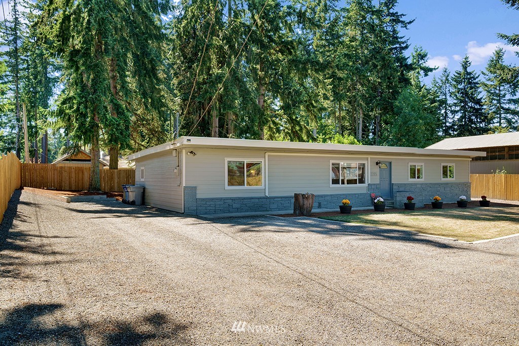 11225 Southeast 22nd Street Renton, WA 98055 - Photo 4 of 28 a view of a house with backyard and sitting area