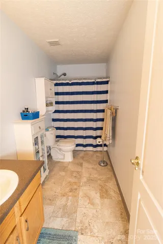 a view of bathroom and utility room