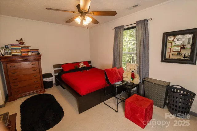 a bedroom with furniture and a window