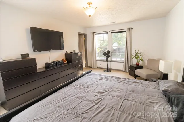 a living room with a flat screen tv and a couch