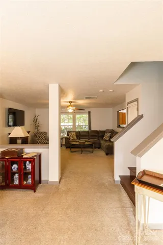 a view of a livingroom with furniture and a fireplace
