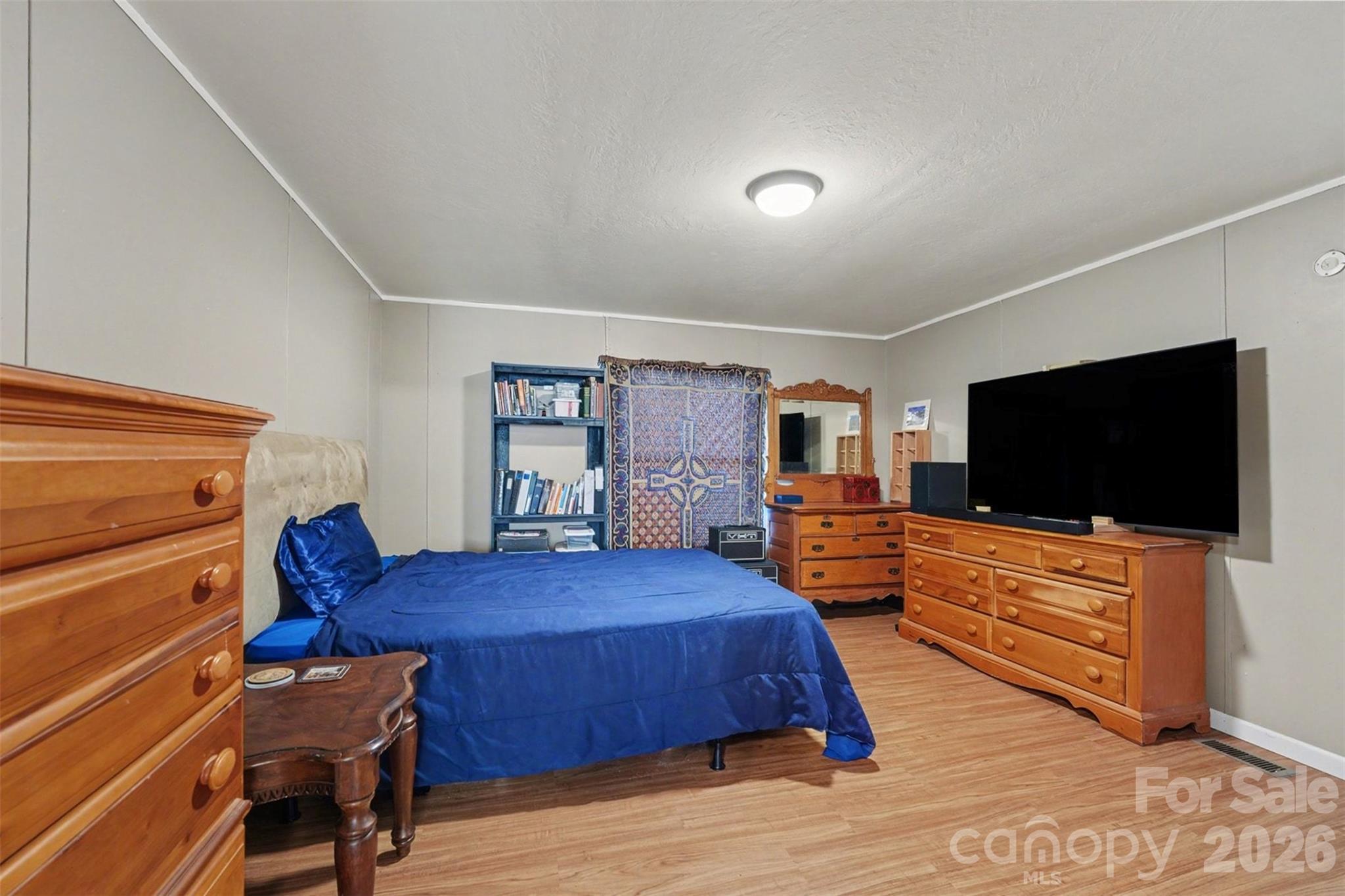 940 John Miller Road Rockwell, NC 28138 - Photo 14 of 28 a bedroom with a bed and a flat screen tv