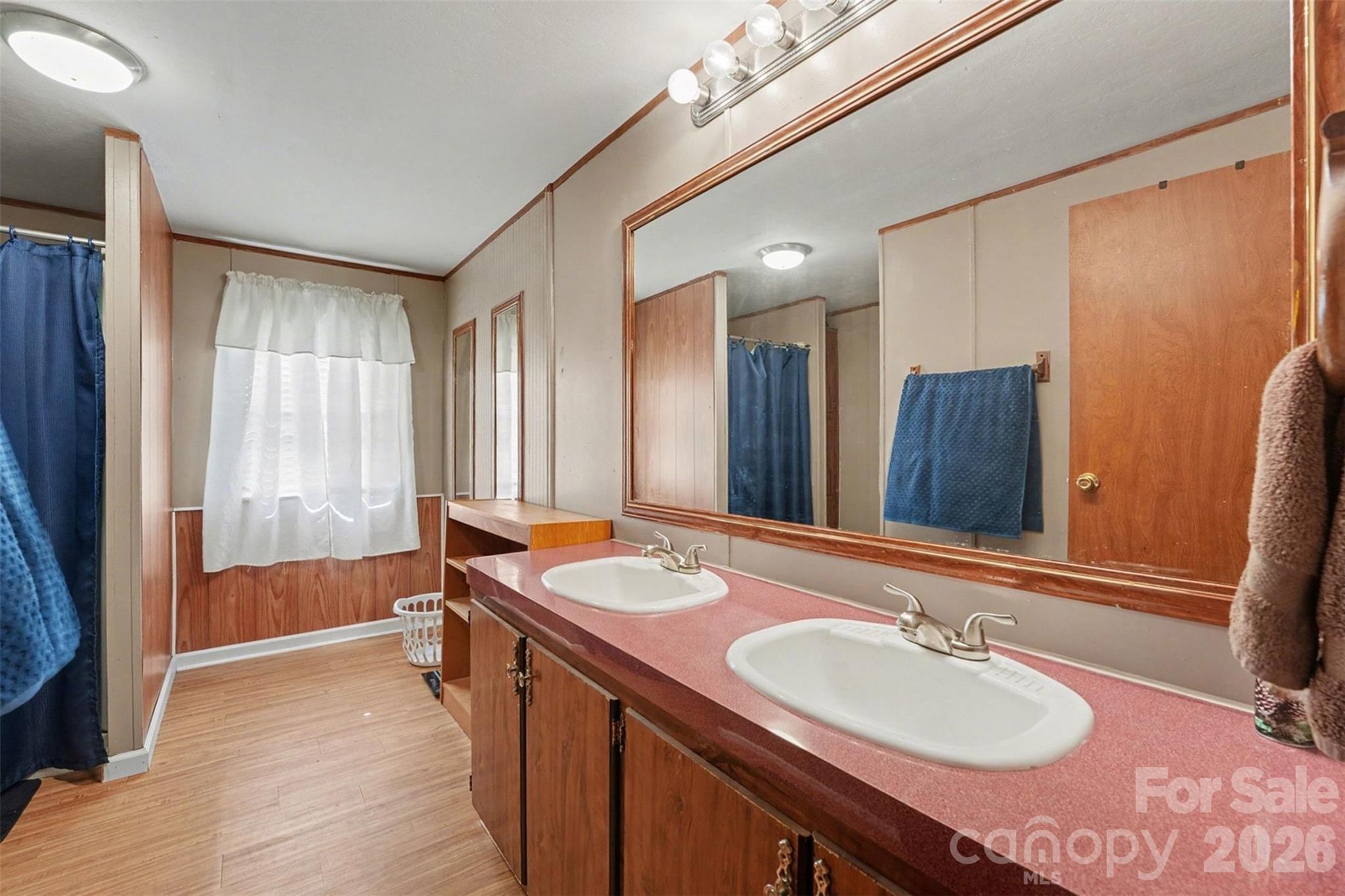 940 John Miller Road Rockwell, NC 28138 - Photo 15 of 28 a bathroom with a double vanity sink and a mirror