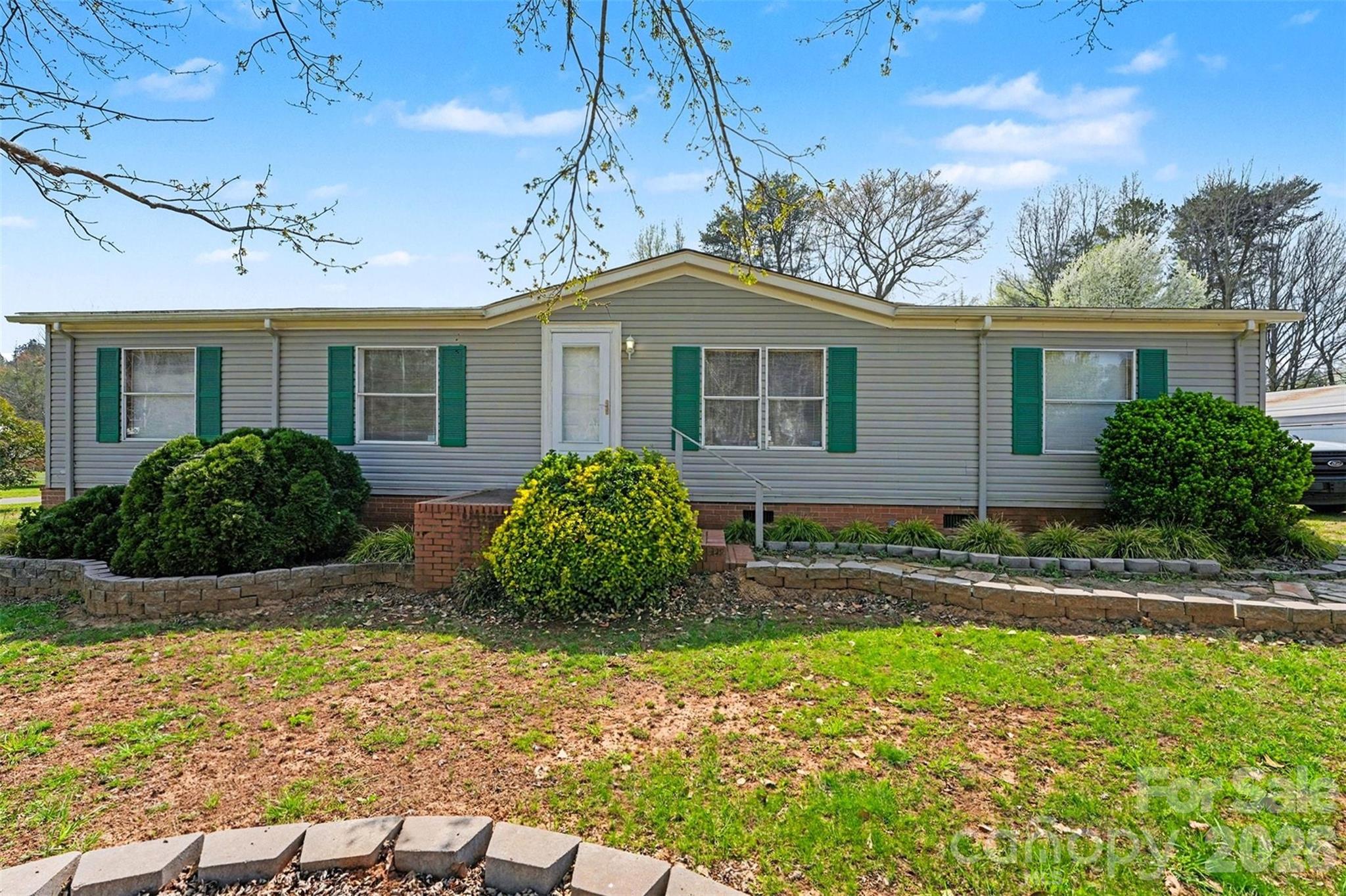 940 John Miller Road Rockwell, NC 28138 - Photo 2 of 28 a front view of a house with garden