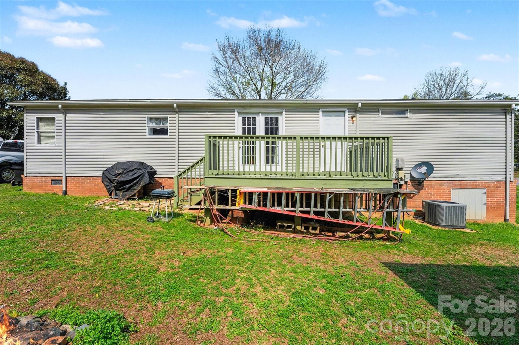 940 John Miller Road Rockwell, NC 28138 - Photo 24 of 28 front view of a house with a yard and deck area