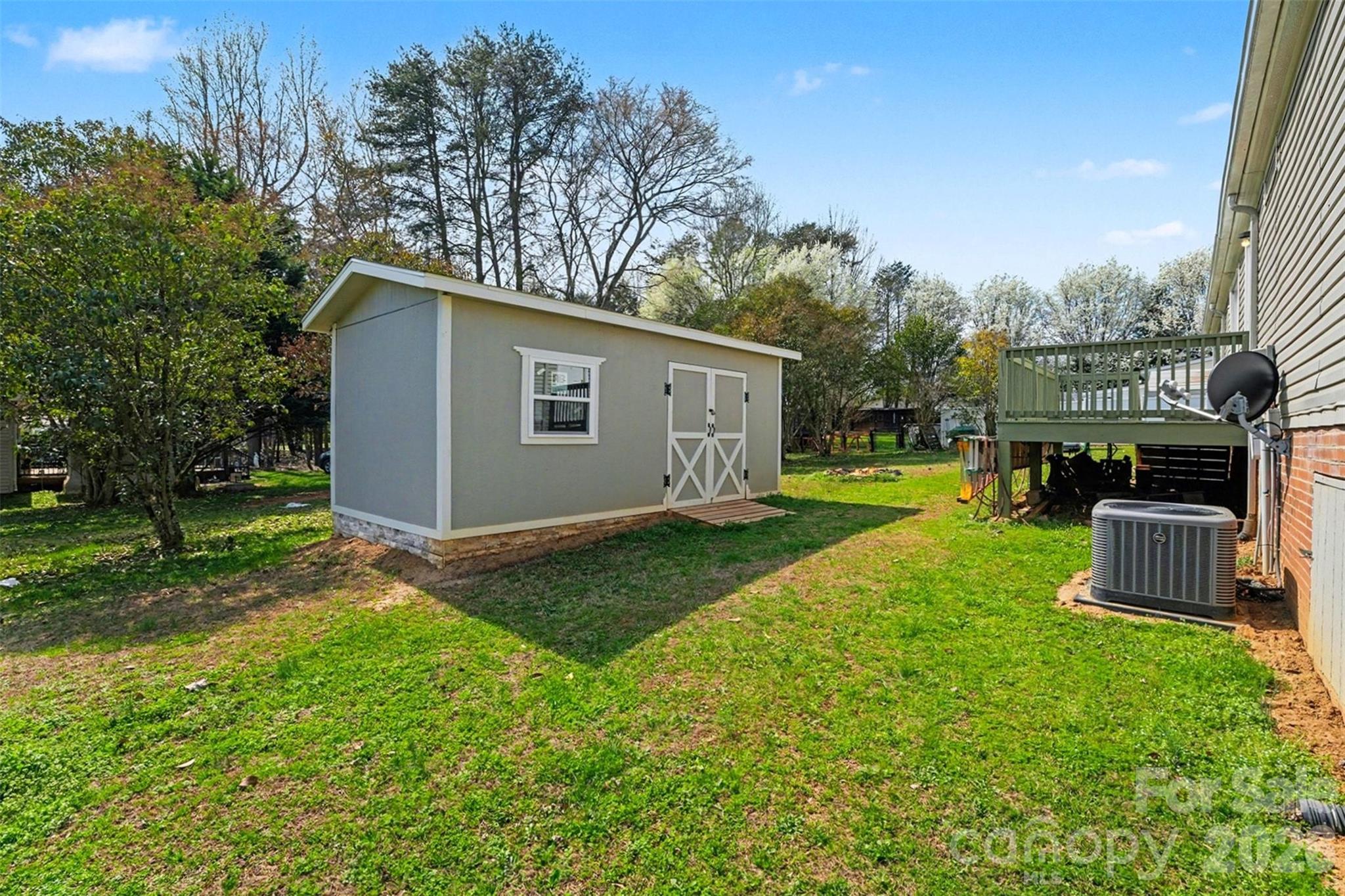 940 John Miller Road Rockwell, NC 28138 - Photo 26 of 28 a view of a backyard with a garden and plants