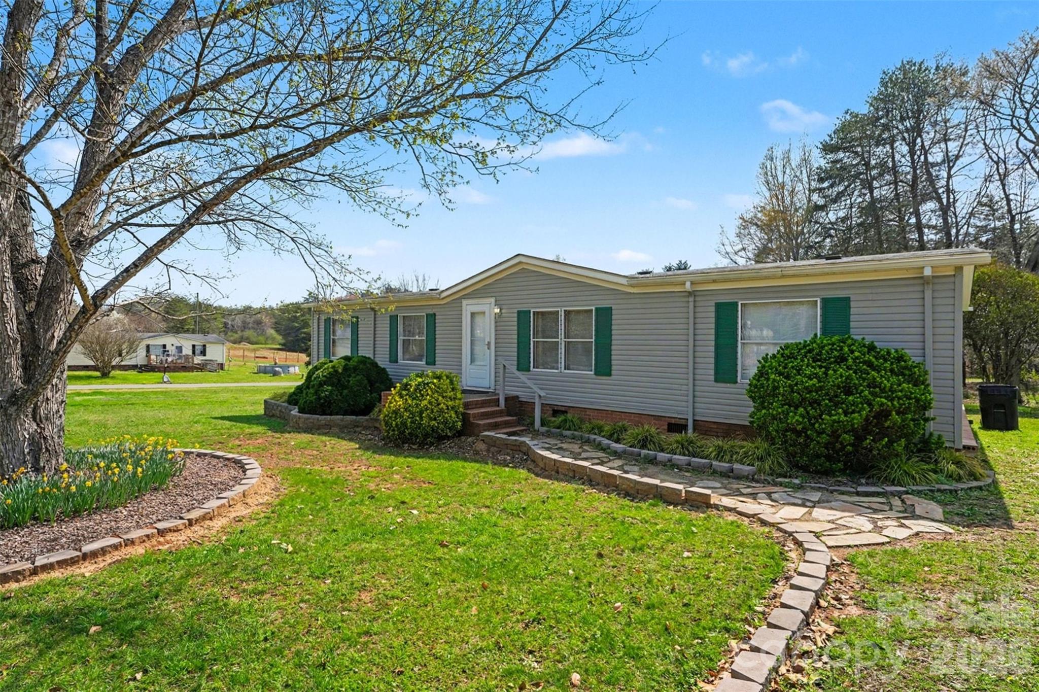 940 John Miller Road Rockwell, NC 28138 - Photo 3 of 28 a view of a house with backyard and garden