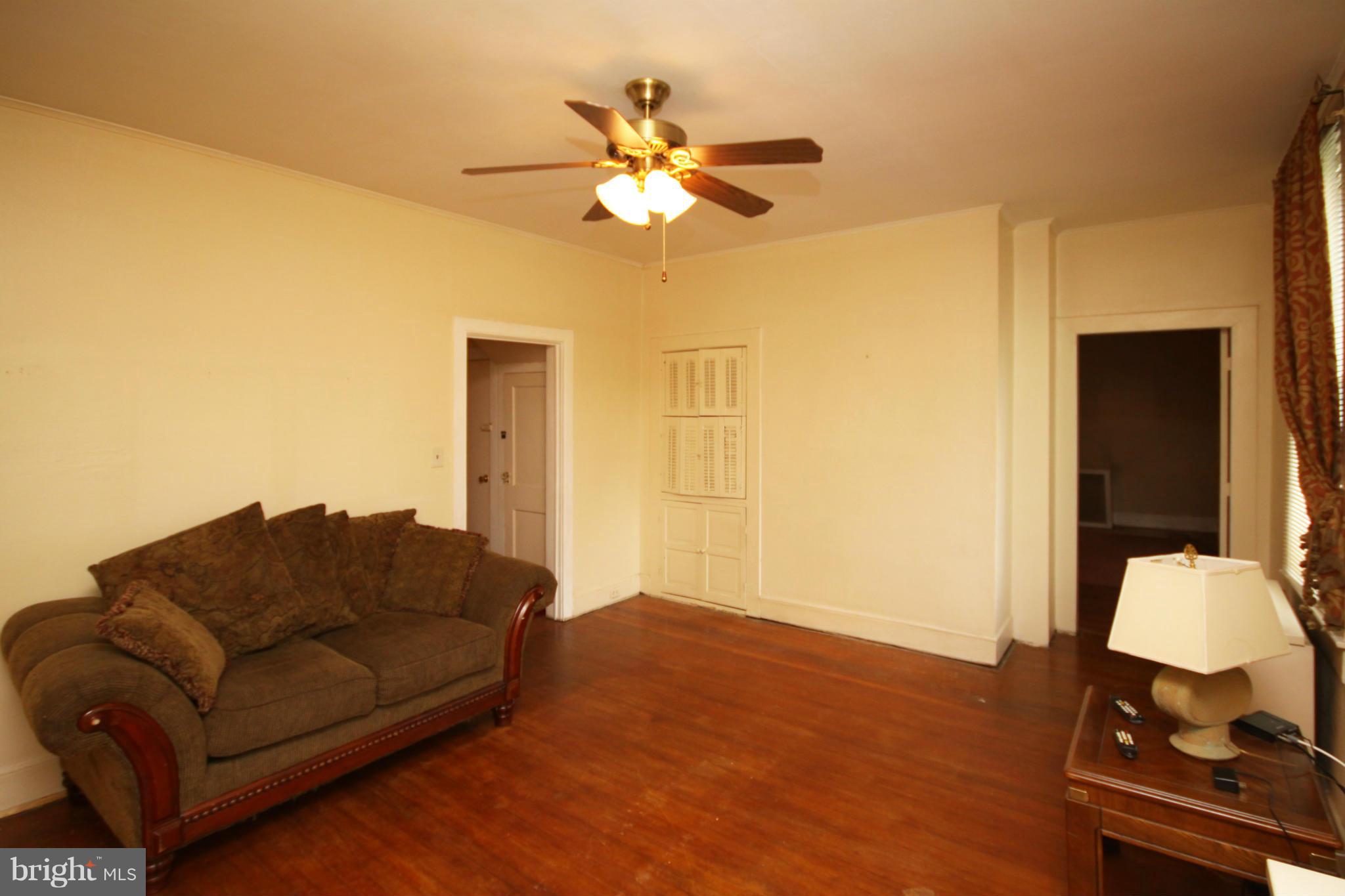 1610 South Rolling Road Baltimore, MD 21227 - Photo 3 of 19 a living room with furniture and a chandelier