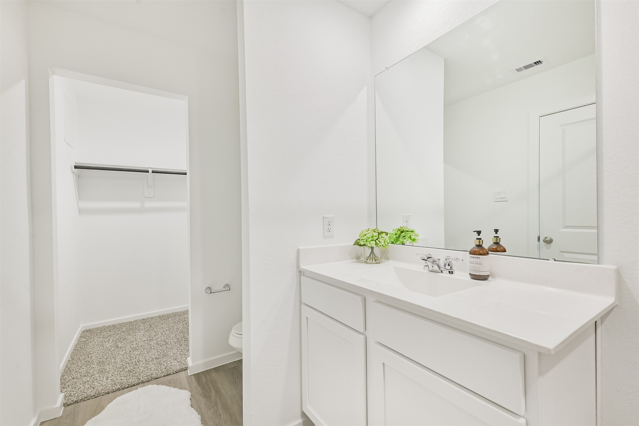 819 Sweet Jubilee Lane Houston, TX 77090 - Photo 13 of 25 a bathroom with a sink and a toilet