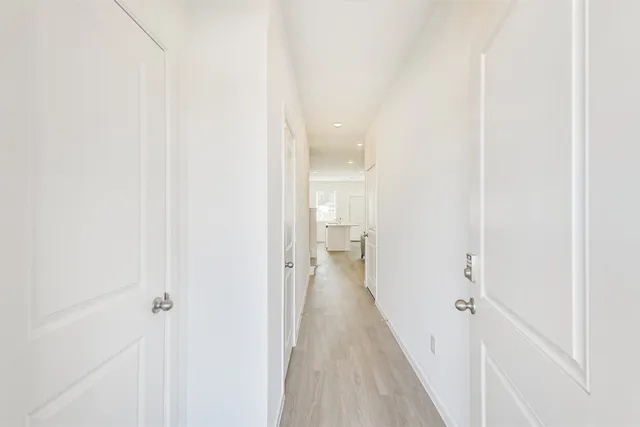 a view of a bathroom from the hallway