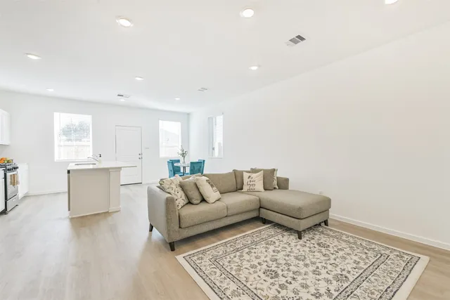 a living room with furniture and a rug