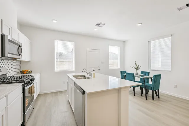 a kitchen with counter and cabinets