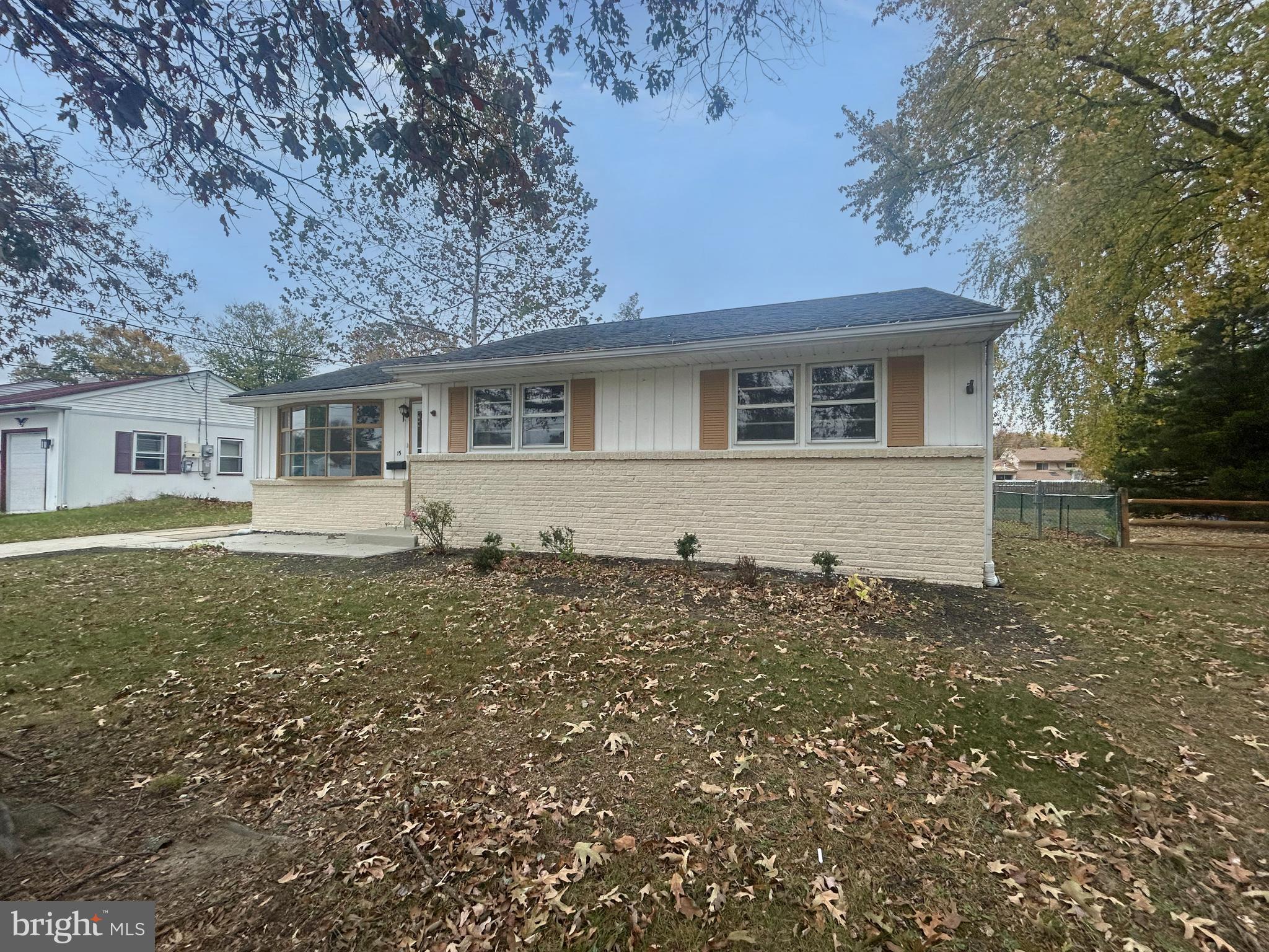 a house with trees in the background