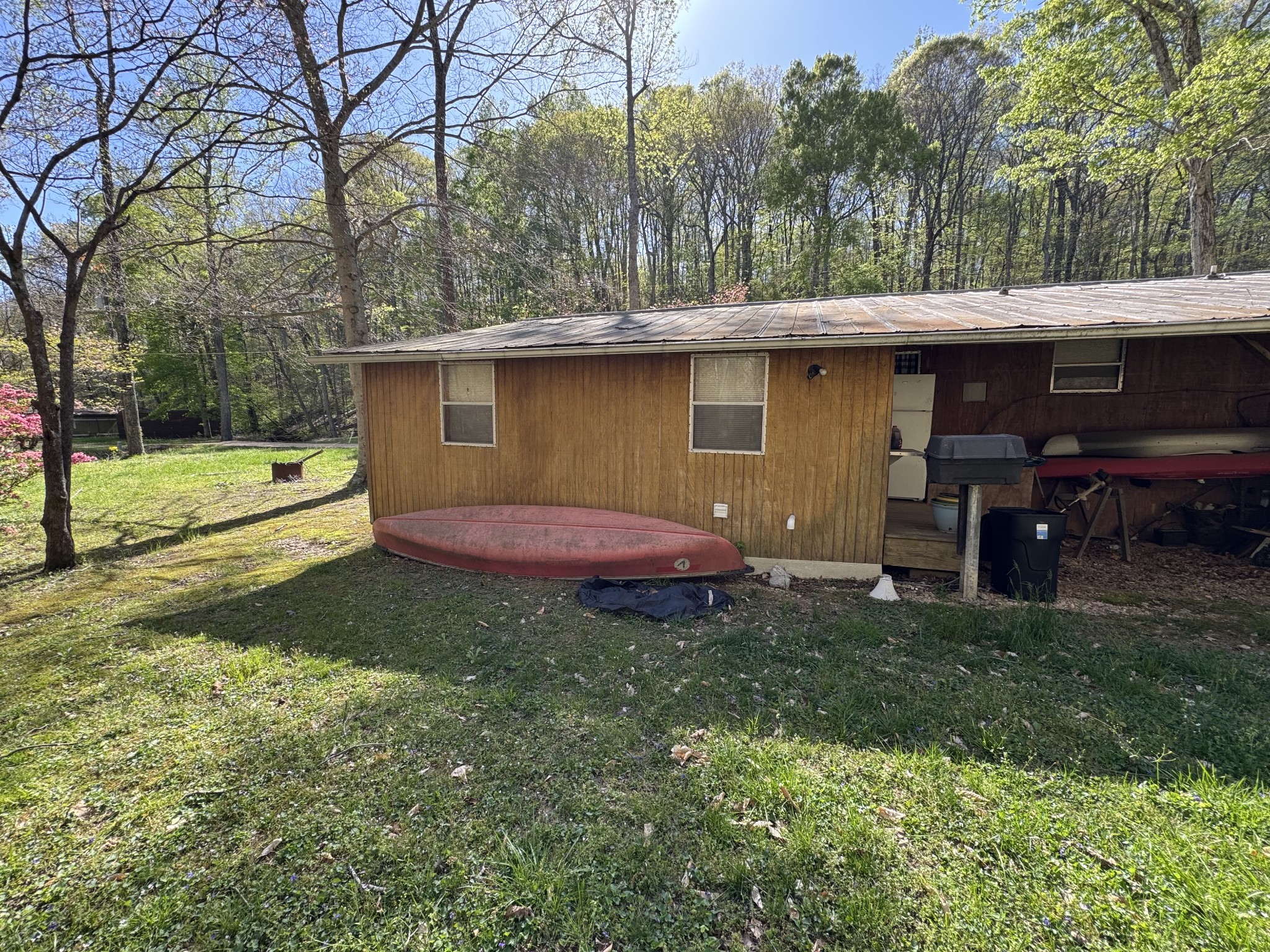 100 Haylee Road Waverly, TN 37185 - Photo 11 of 13 a view of a backyard with a barn
