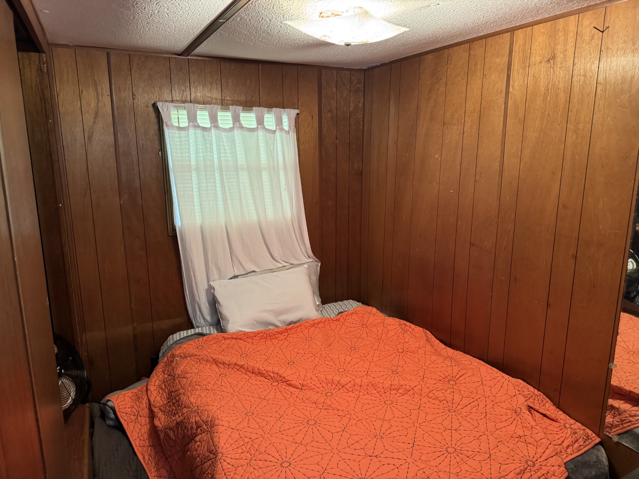 100 Haylee Road Waverly, TN 37185 - Photo 8 of 13 a bedroom with a bed and a window