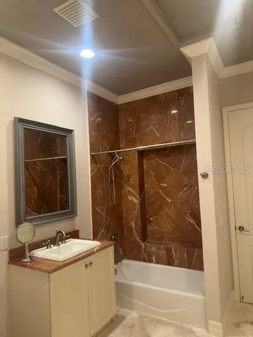 a bathroom with a sink and a bathtub