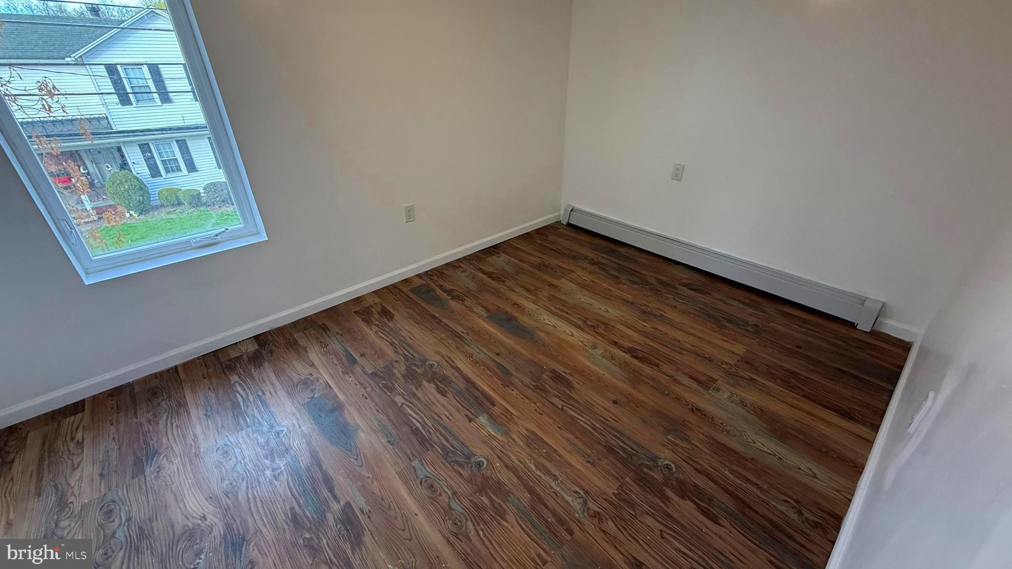 210 Cherry Street Duryea, PA 18642 - Photo 16 of 26 a room with wooden floor and windows